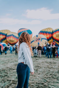 Girl watching balloons as a first time flyer at Albuquerque International Ballon Fiesta