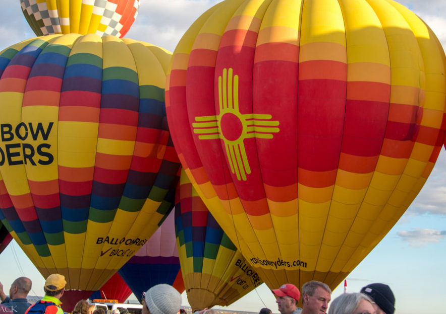 Rainbow Ryders hot air balloons preparing for mass ascension at Albuquerque International Balloon Fiesta.