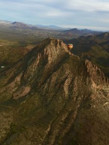 Rainbow Ryders Hot Air Balloon soaring over the Sonoran Desert.