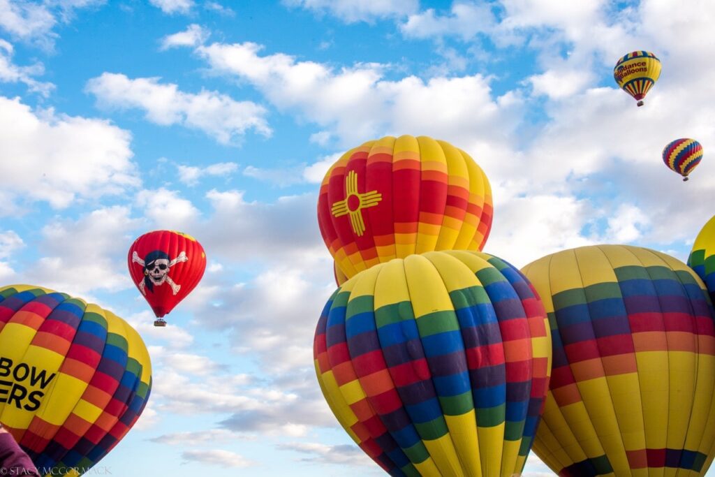 Multiple hot air balloons from a balloon festival
