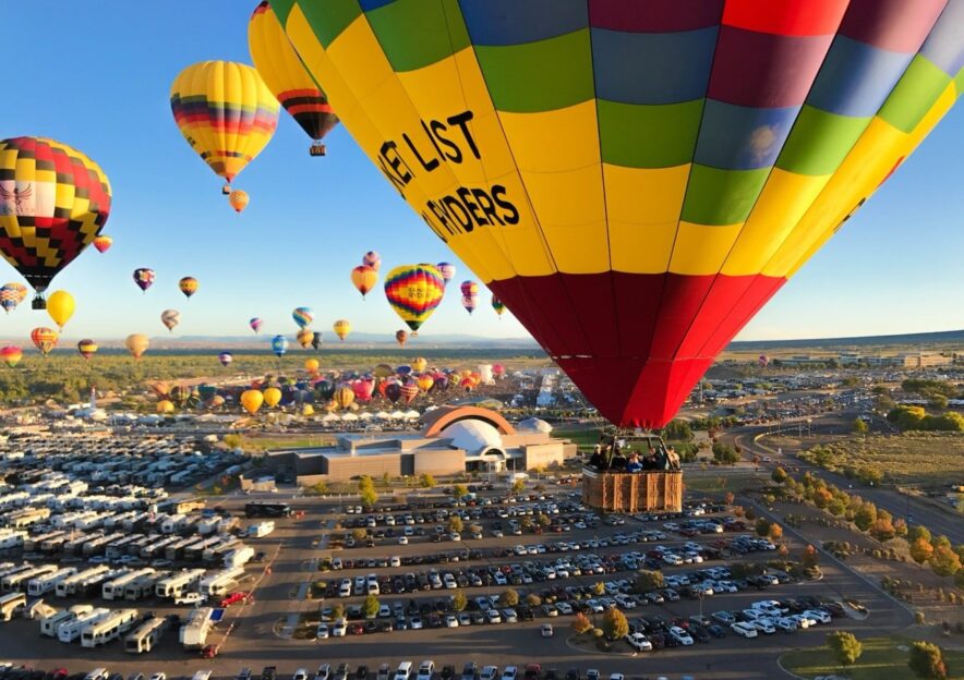 Hot air balloons taking off during festival