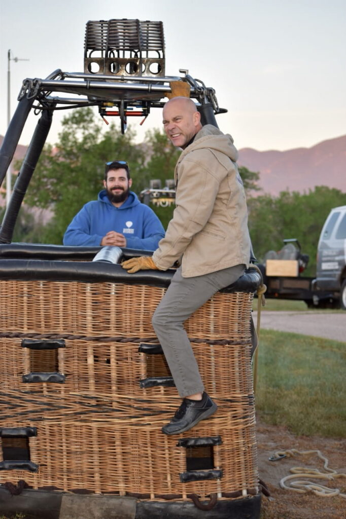 Rainbow Ryders pilot sitting on balloon basket
